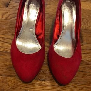 Red suede pumps